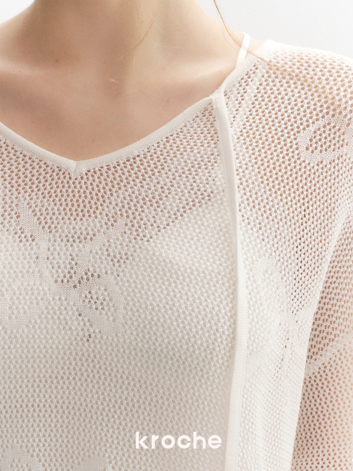 Kroche Loose lace up long sleeved knitted top